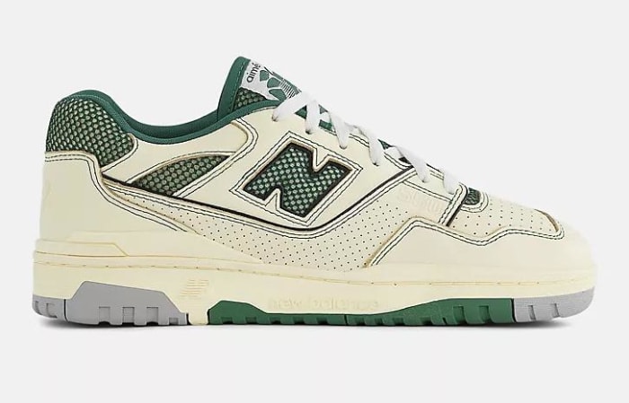 Side view of tan and green New Balance sneakers.